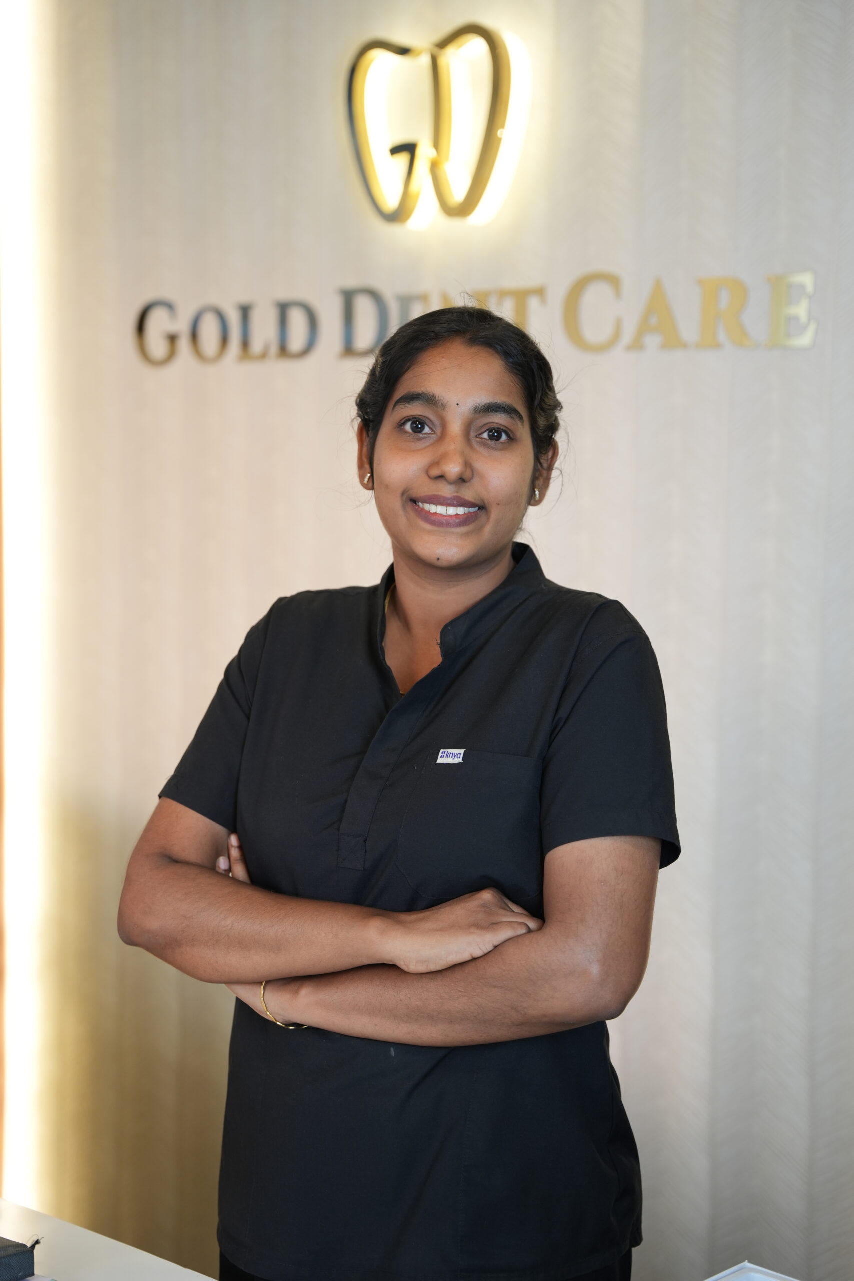 Dental assistant supporting patients at Gold Dent Care
